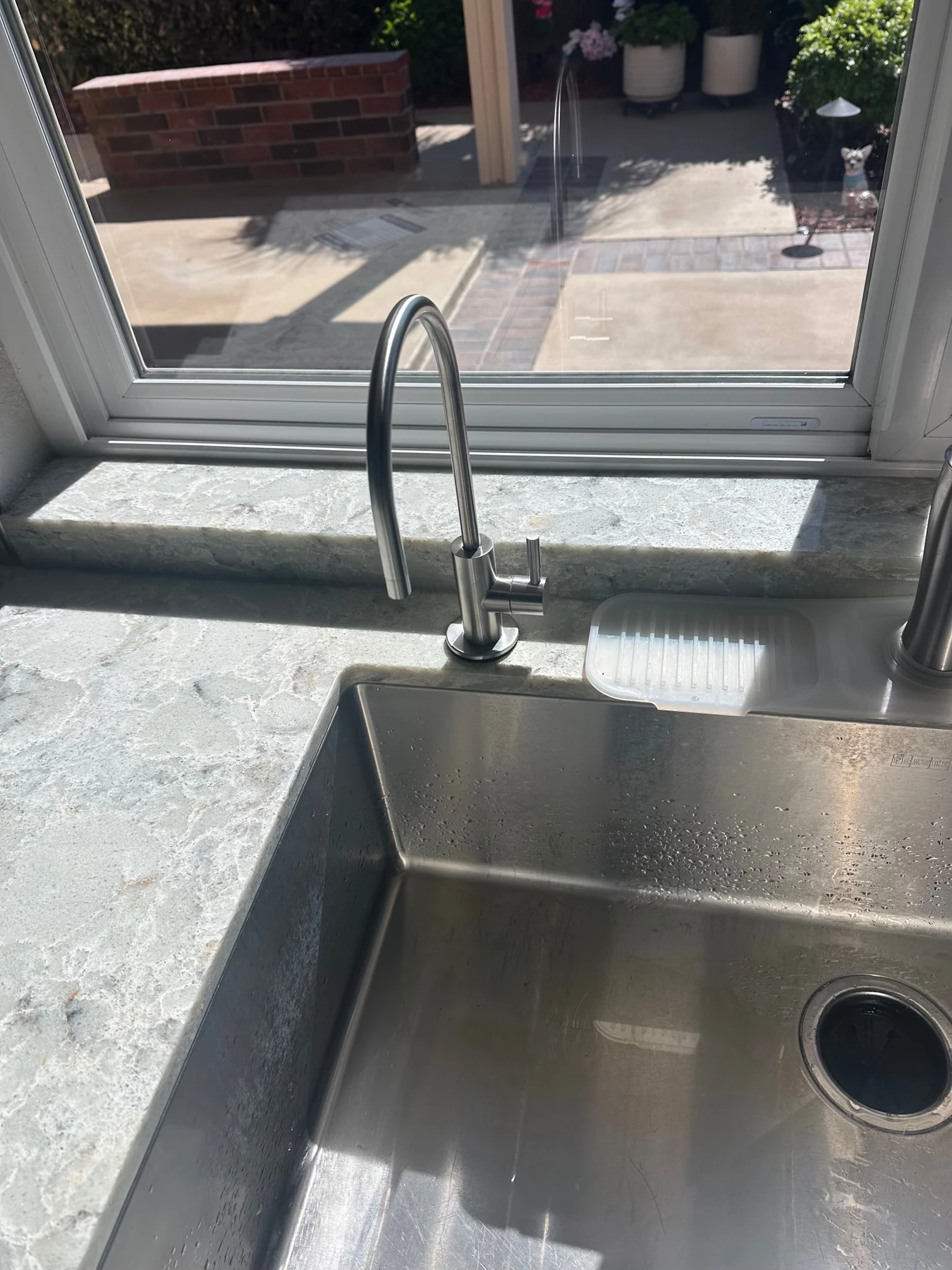 Recently installed kitchen faucet and sink by Mulhearn Plumbing