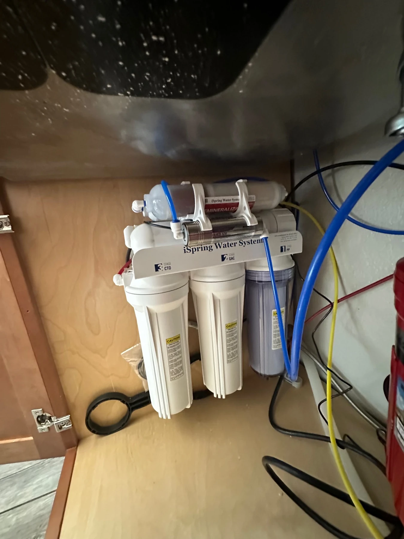 Under-sink water filtration system installed by Mulhearn Plumbing