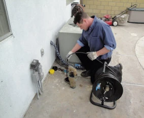 Mulhearn Plumbing technician operating drain-cleaning equipment